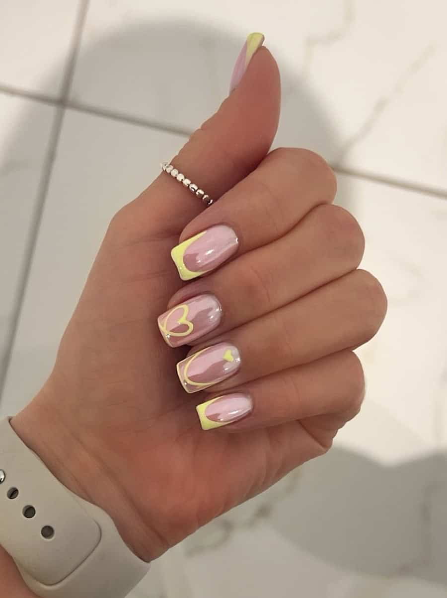 Nude nails with yellow tips and statement art in chrome finish