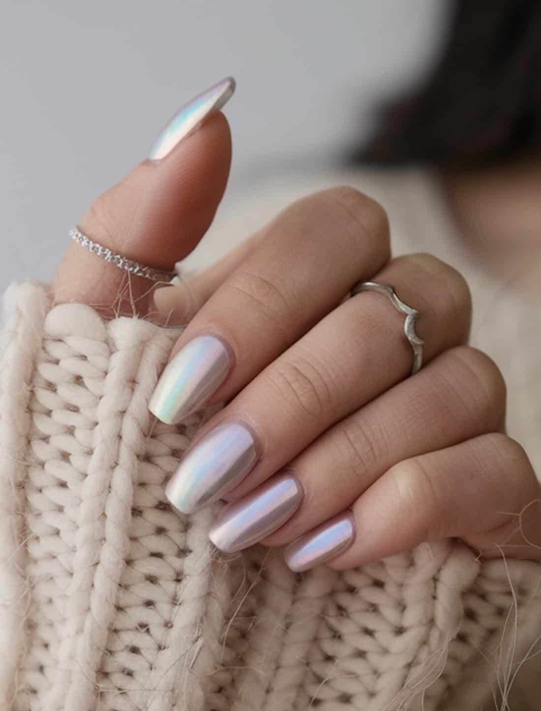 Iridescent nail polish on short pointed nails