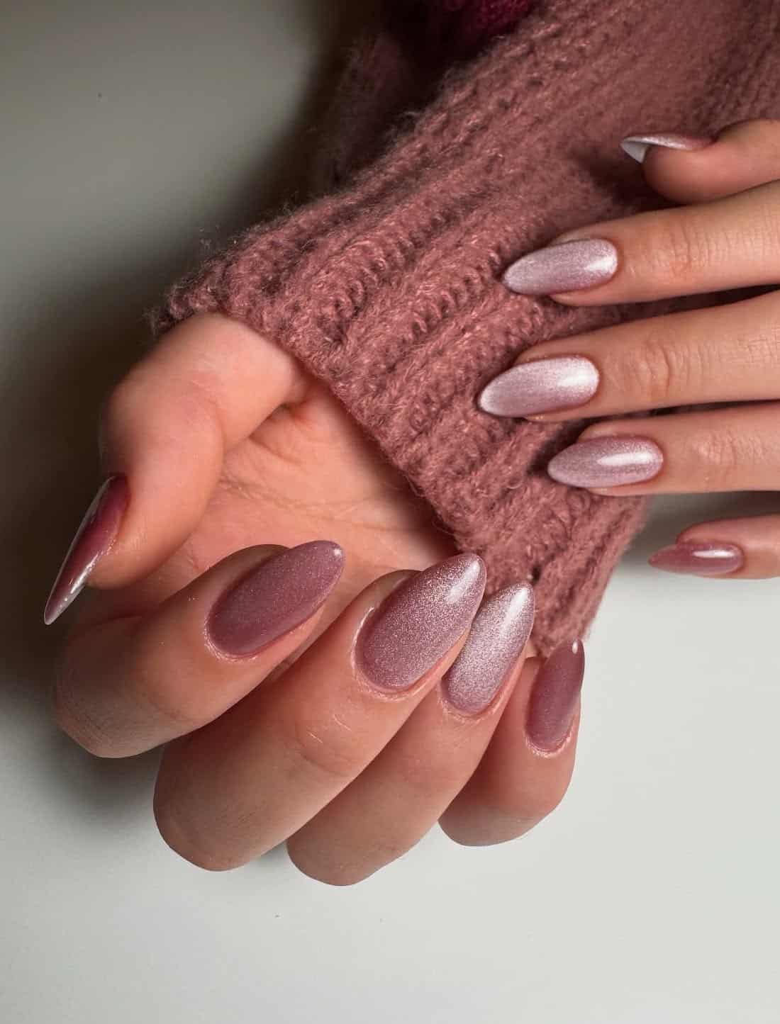 Long almond nails in the shape of a pink cat eye