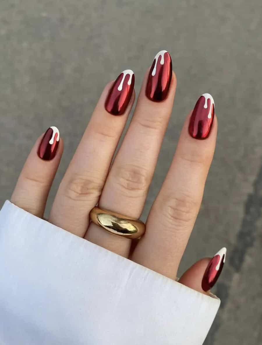 red chrome nails with white dripping tips