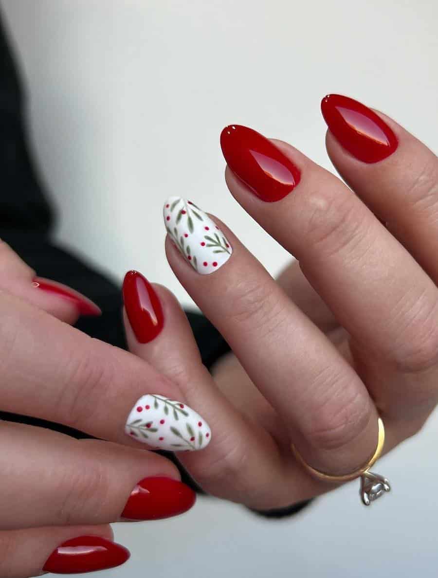 red nails with white accent nails featuring holly berry art