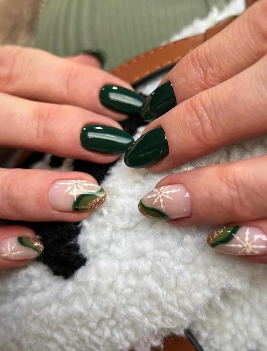 dark green and nude nails with gold glitter and white snowflake art