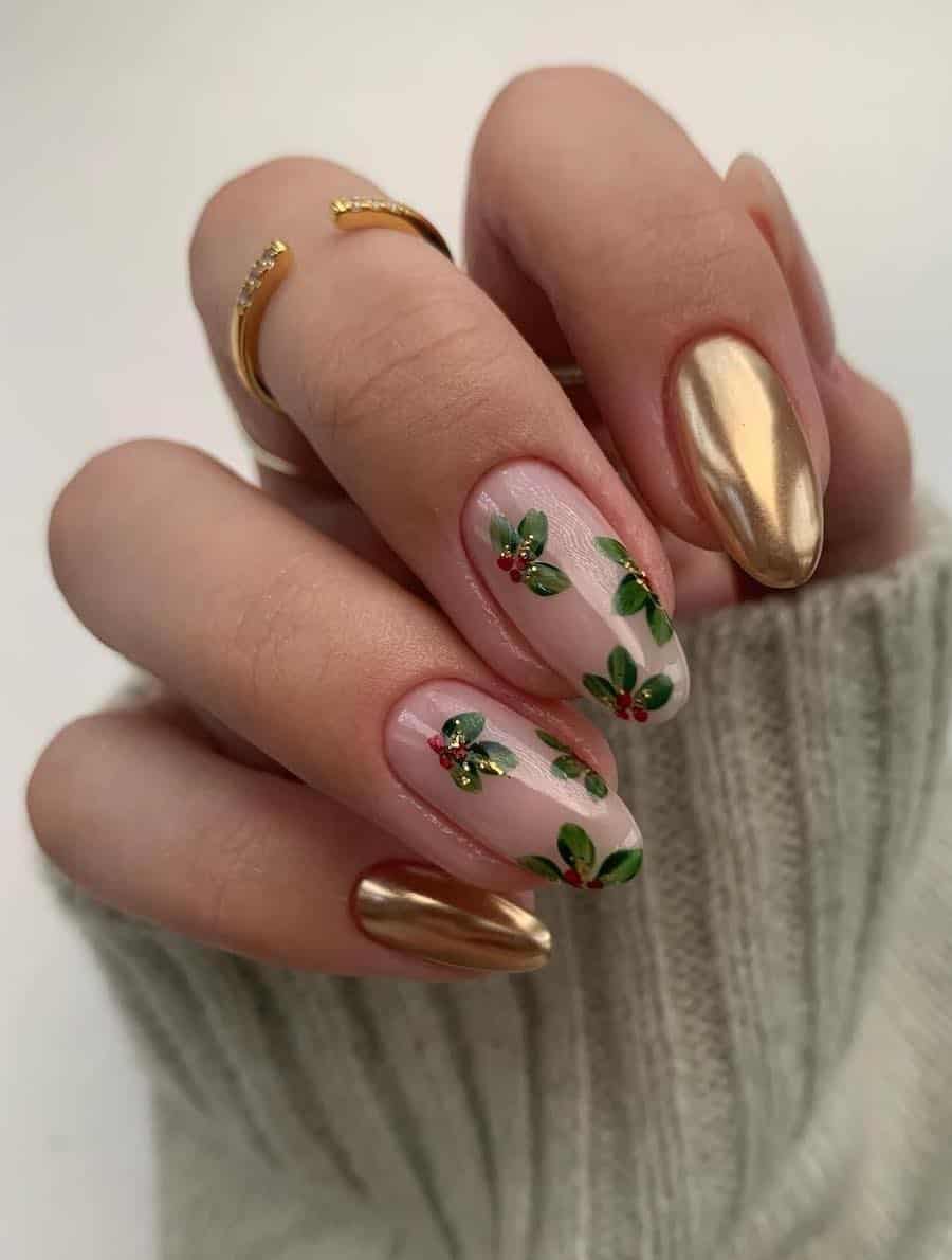 gold chrome nails with nude accent nails featuring red and green christmas foliage art