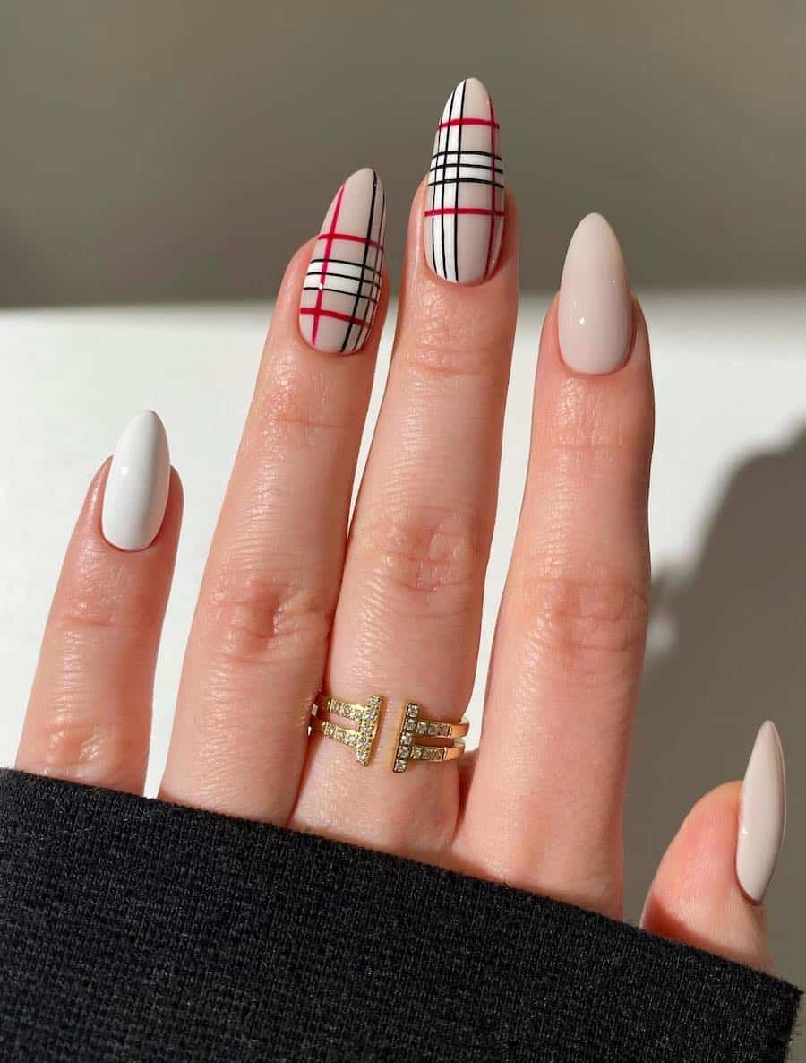 beige and white nails with plaid accent nails