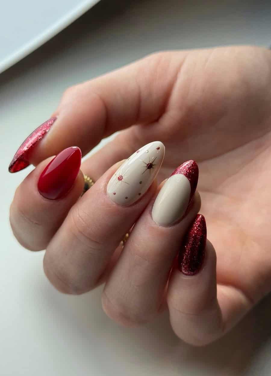 red and cream christmas nails with glitter and star art accents