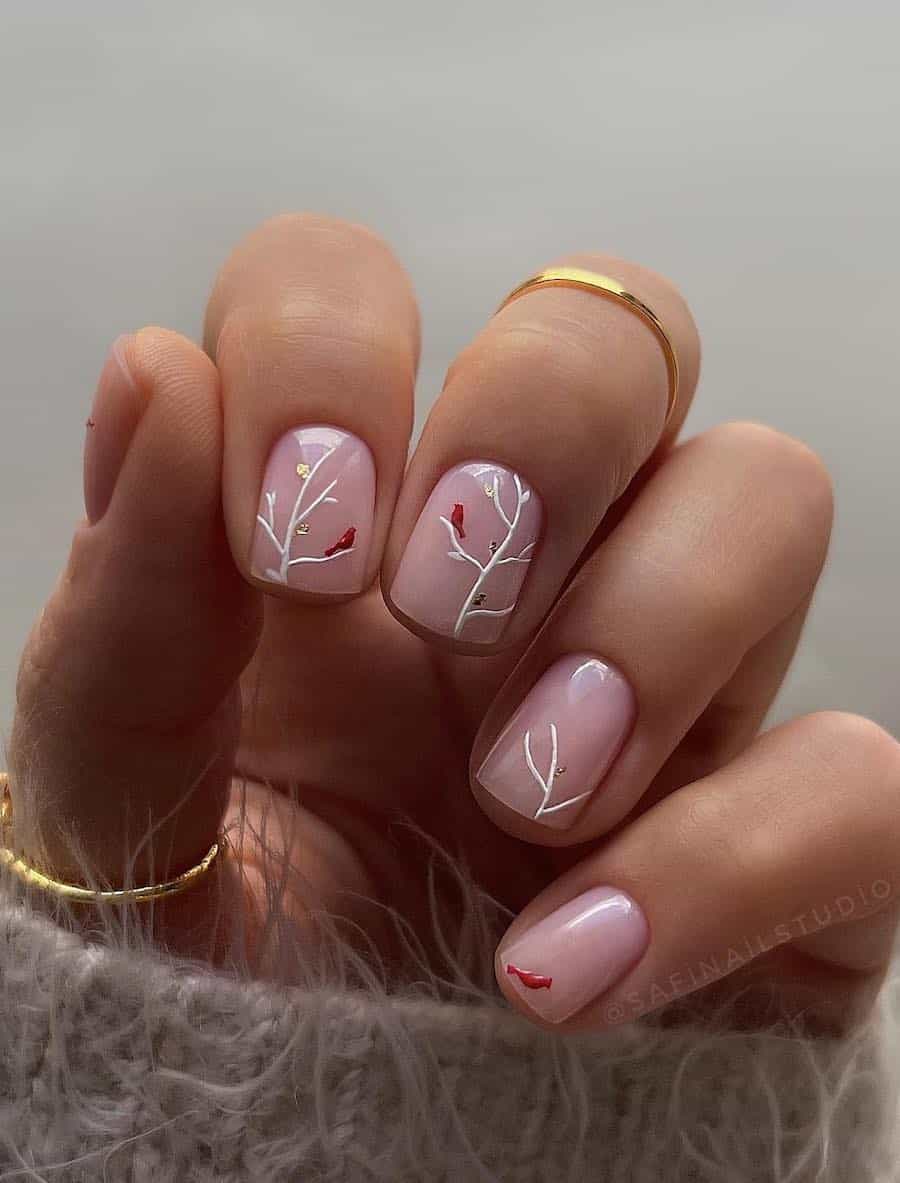 nude pink nails with winter tree art and red birds
