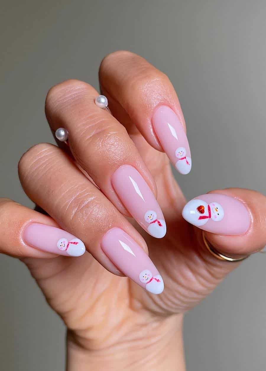 nude pink nails with snowman french tips