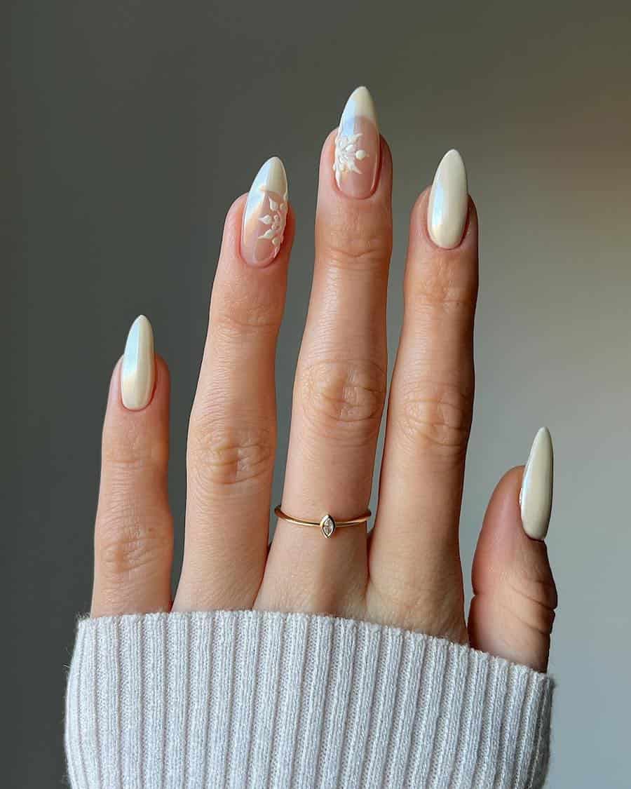cream-colored chrome nails with french tip and snowflake accent nails
