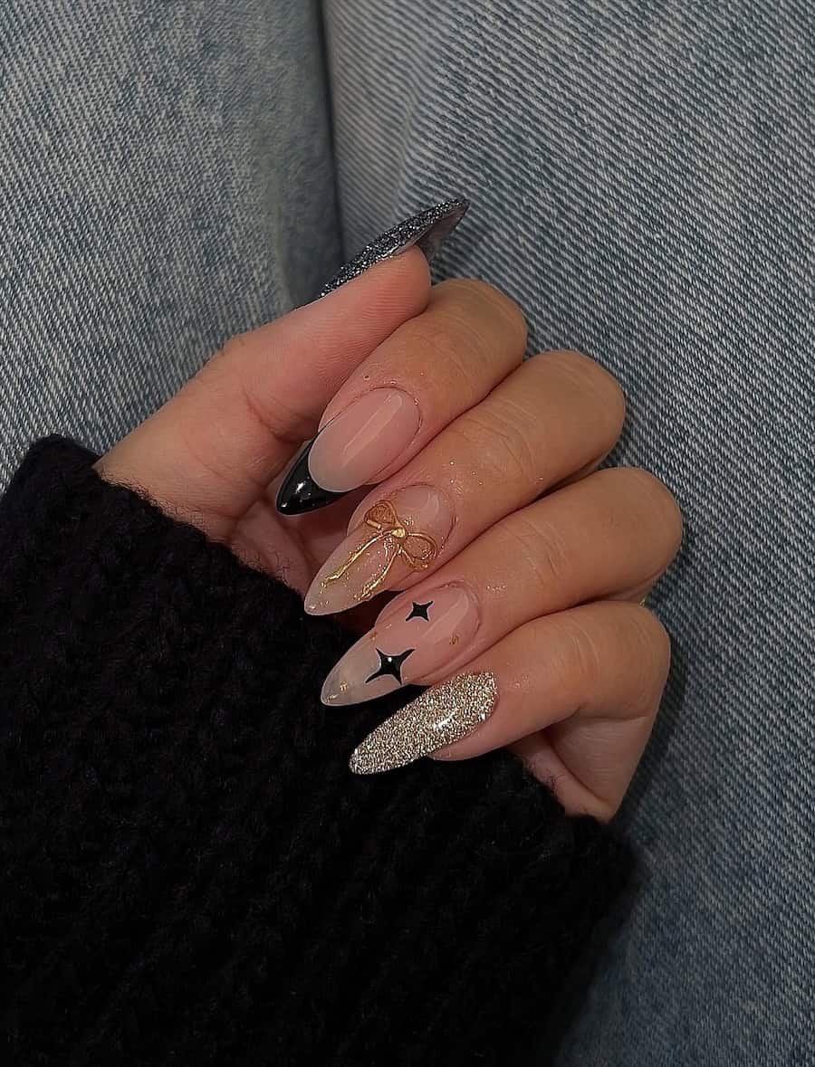 nude nails with gold and black holiday art