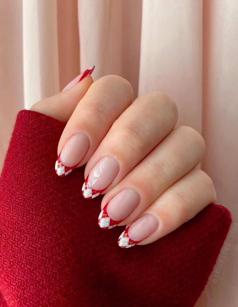 nude nails with red and white plaid tips