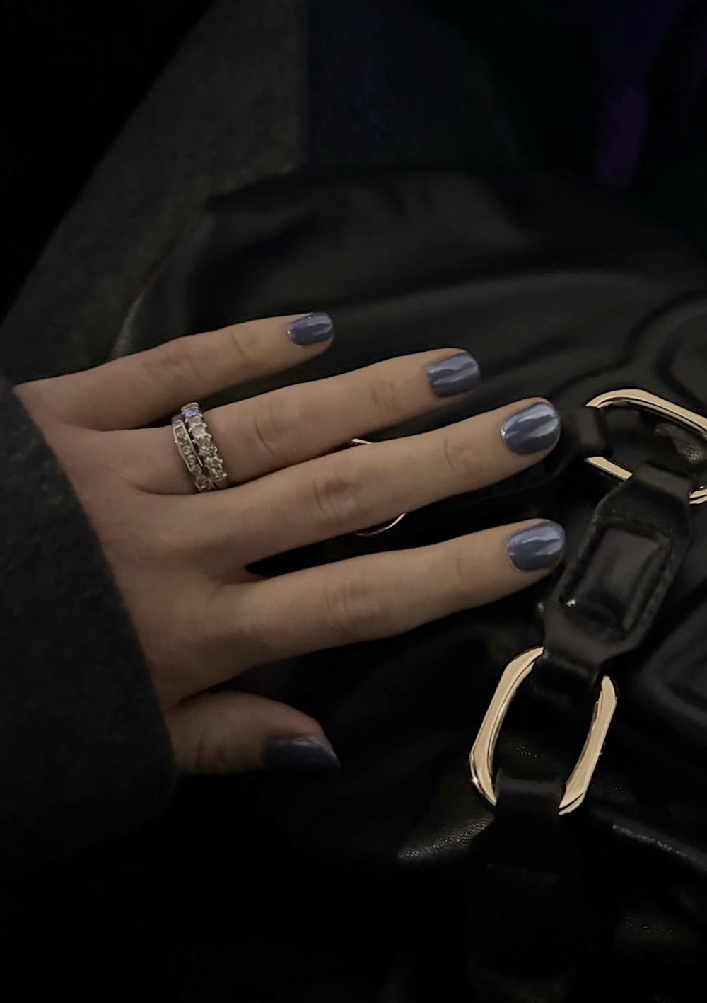 Short blue nails with chrome top coat