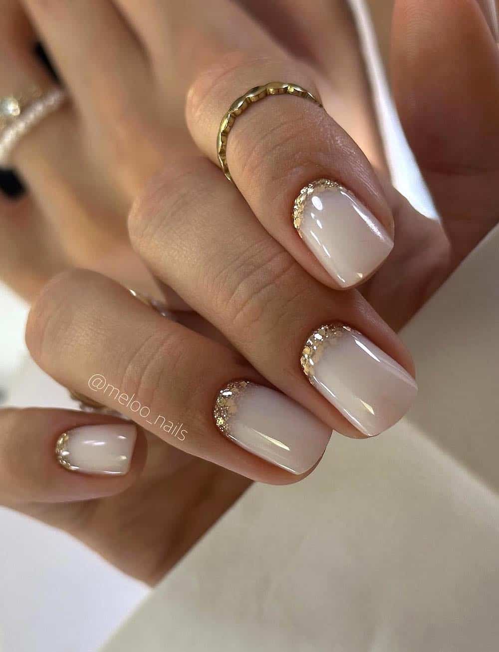 Short milky nails with chunky shiny French tips