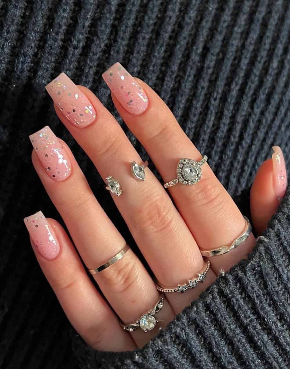 Medium length pink nails with chunky silver glitter