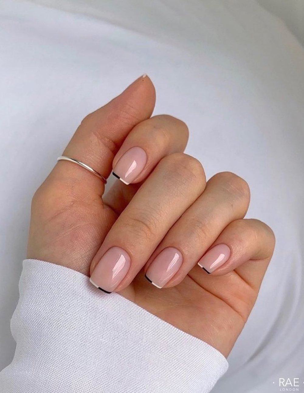 Short nude nails with two-tone French tips