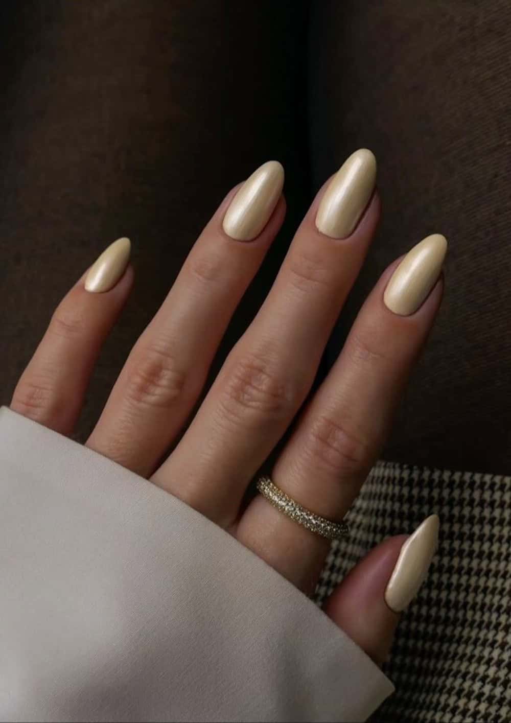 Long chrome yellow almond nails