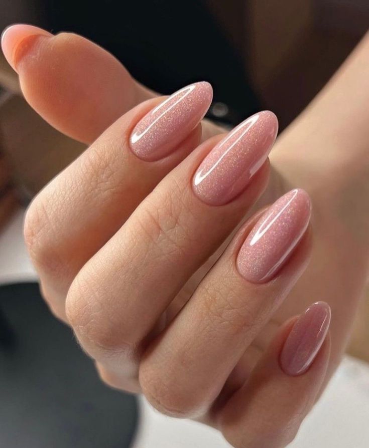 2. Elegant Shimmering Pink Almond Nails for a Sophisticated Look