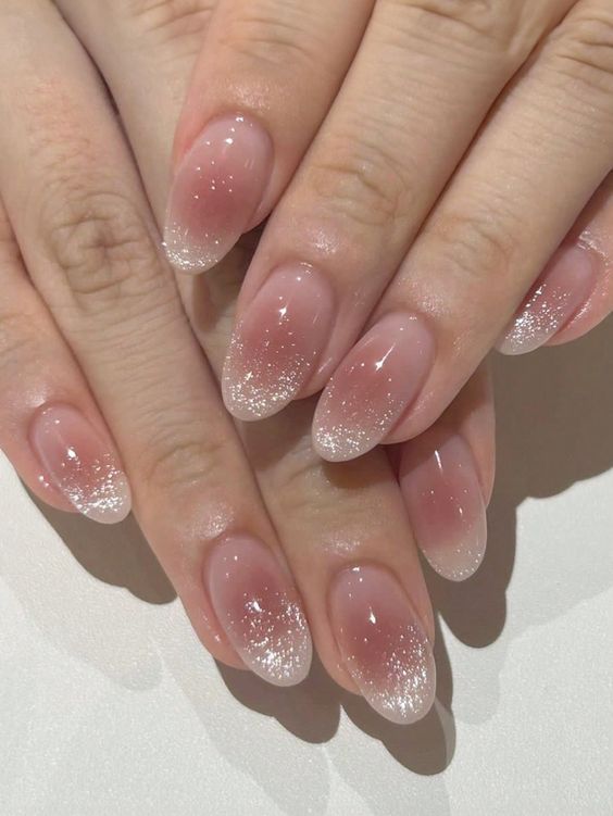 14. Elegant Glitter Ombre for Short Almond Nails