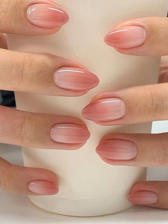 6. Soft Ombre Elegance: A Delicate Take on Short Almond Nails