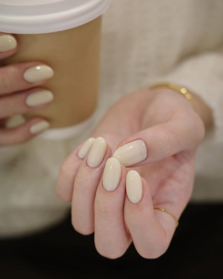 11. Soft Cream Elegance for Minimalist Almond Nails