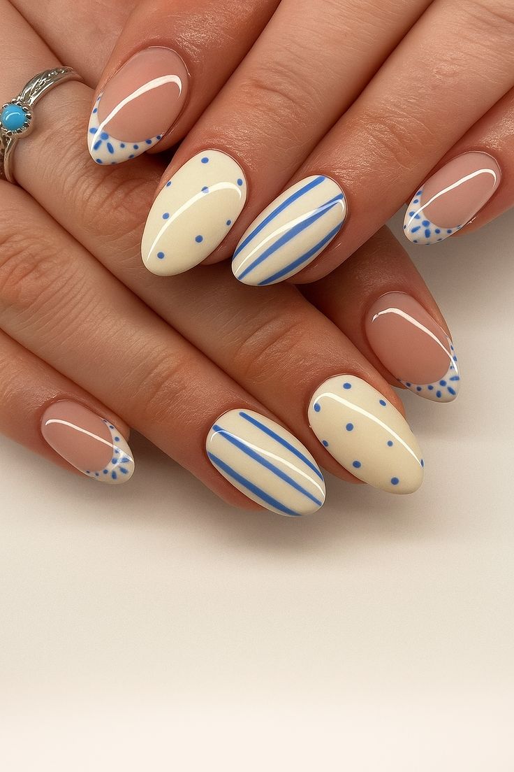 15. Dive into Playful Elegance with Blue and White Almond Nail Designs