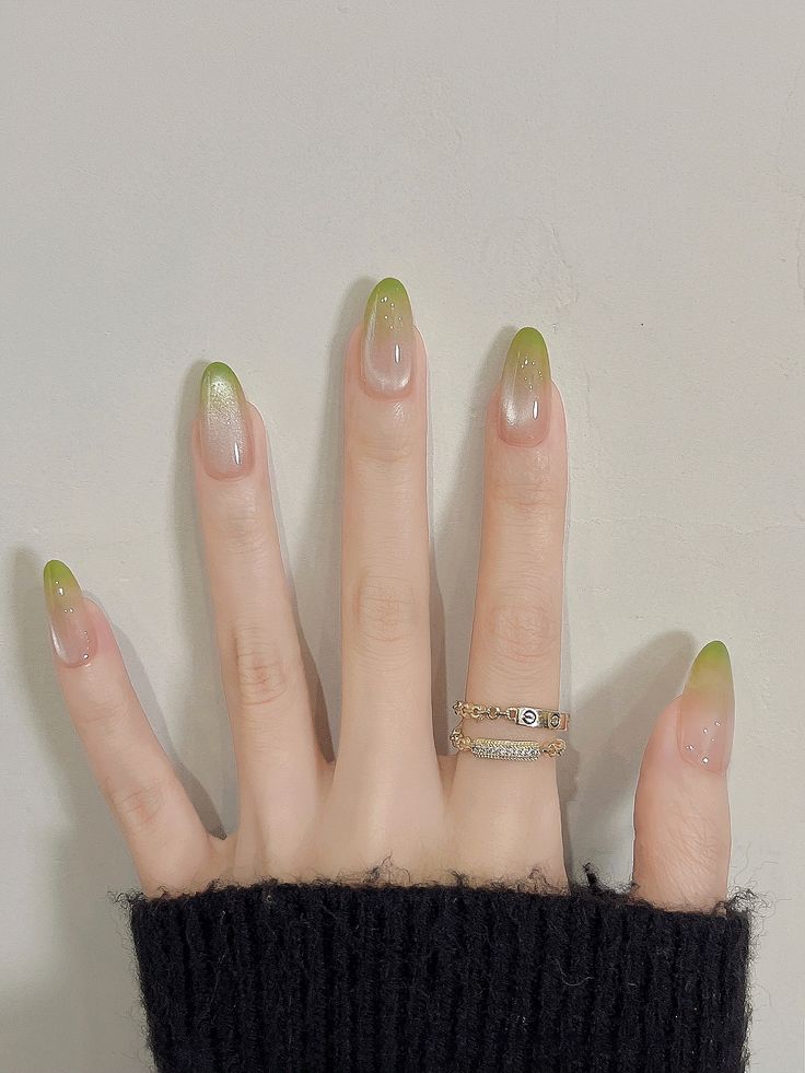 3. Elegant Green Gradient Short Almond Nails with Subtle Shine