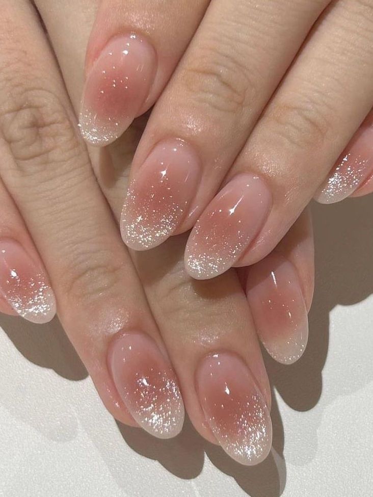 21. Glitter-Frosted Short Almond Nails for a Subtle Sparkle