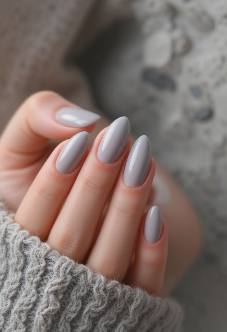15. Effortless Sophistication with Soft Gray Short Almond Nails