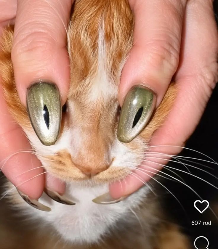 23. Mesmerizing Metallic Green Almond Nails with a Playful Twist