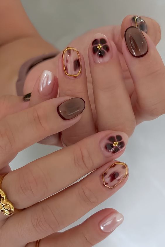 7. Elegant Florals and Earthy Tones for Short Almond Nails