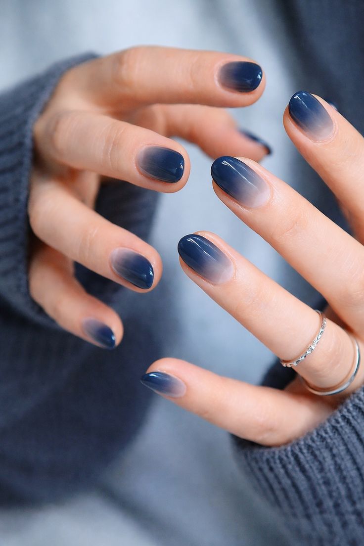 6. Subtle Elegance with Navy Blue Ombre Short Almond Nails